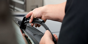 A photo of installing wiper blades. A photo of us installing wiper blades.